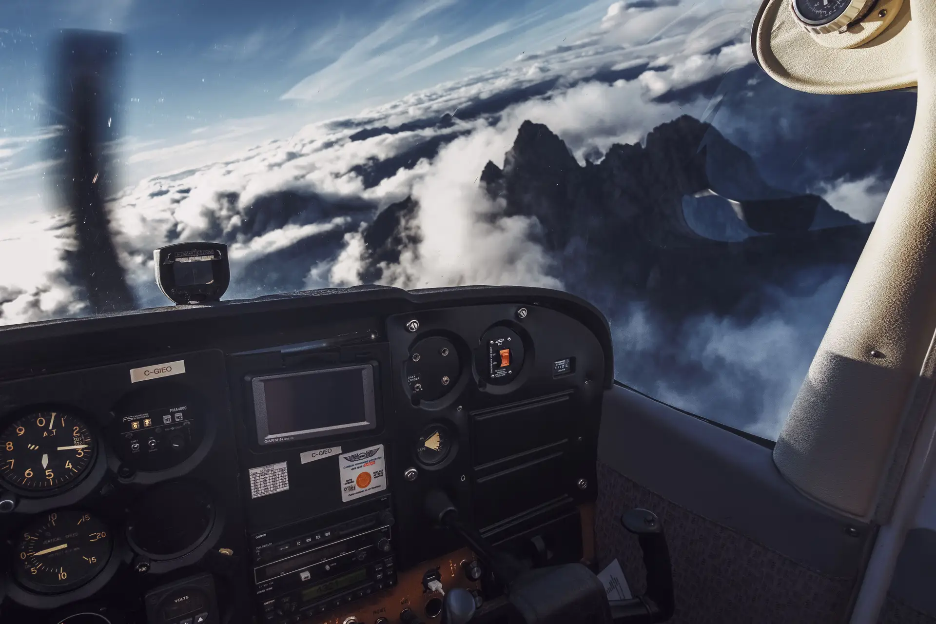 Aerial view of Canadian mountains and flight route from cockpit