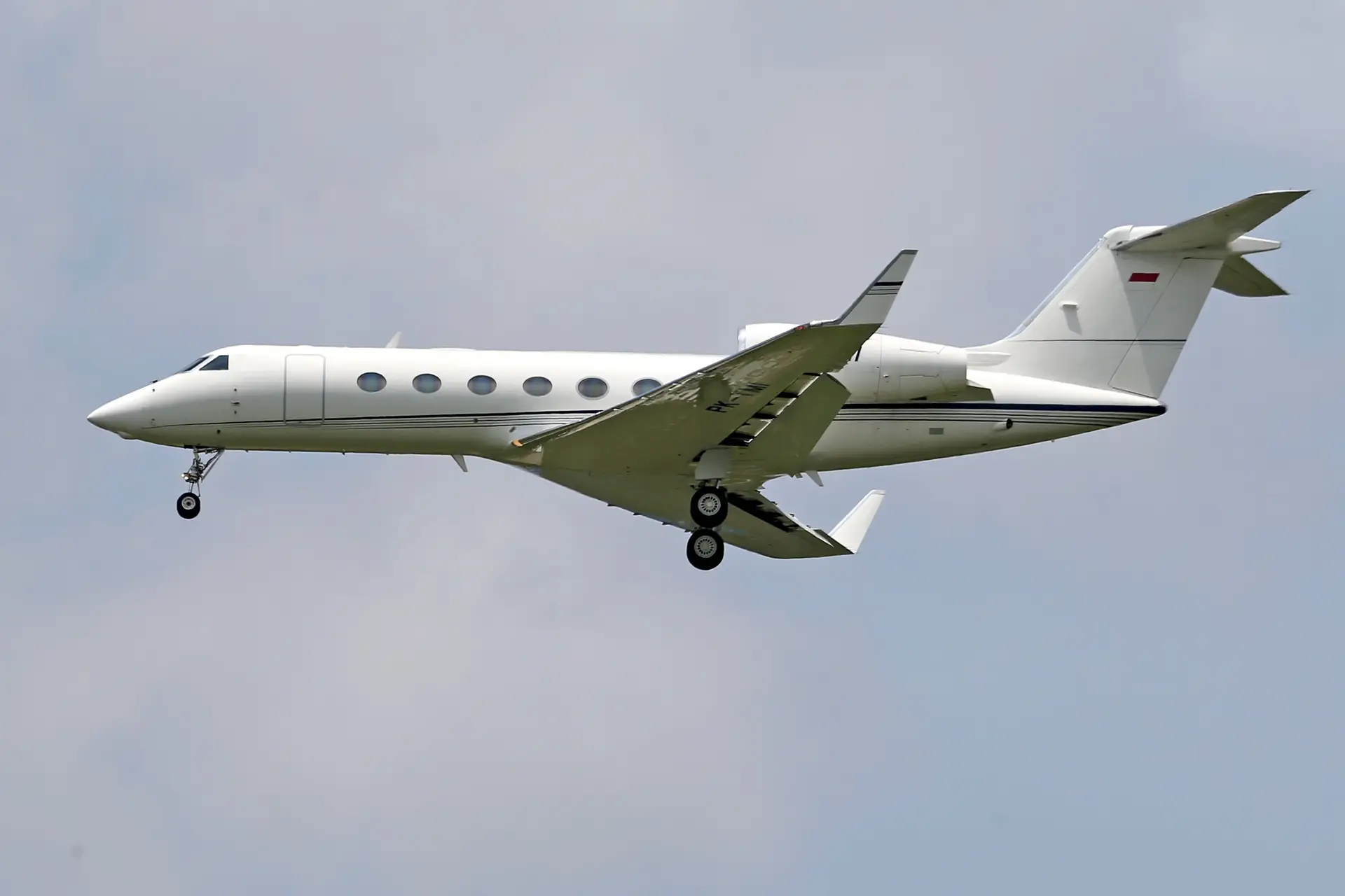 Private executive jet cruising through serene high-altitude skies