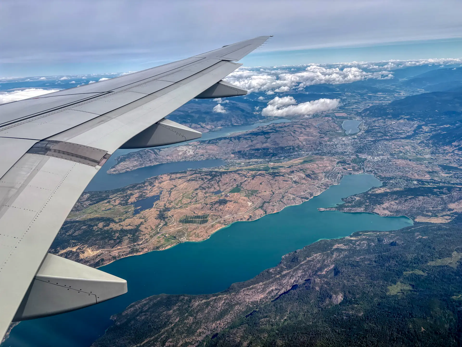 Scenic aerial view of Canadian lake and valley from flight