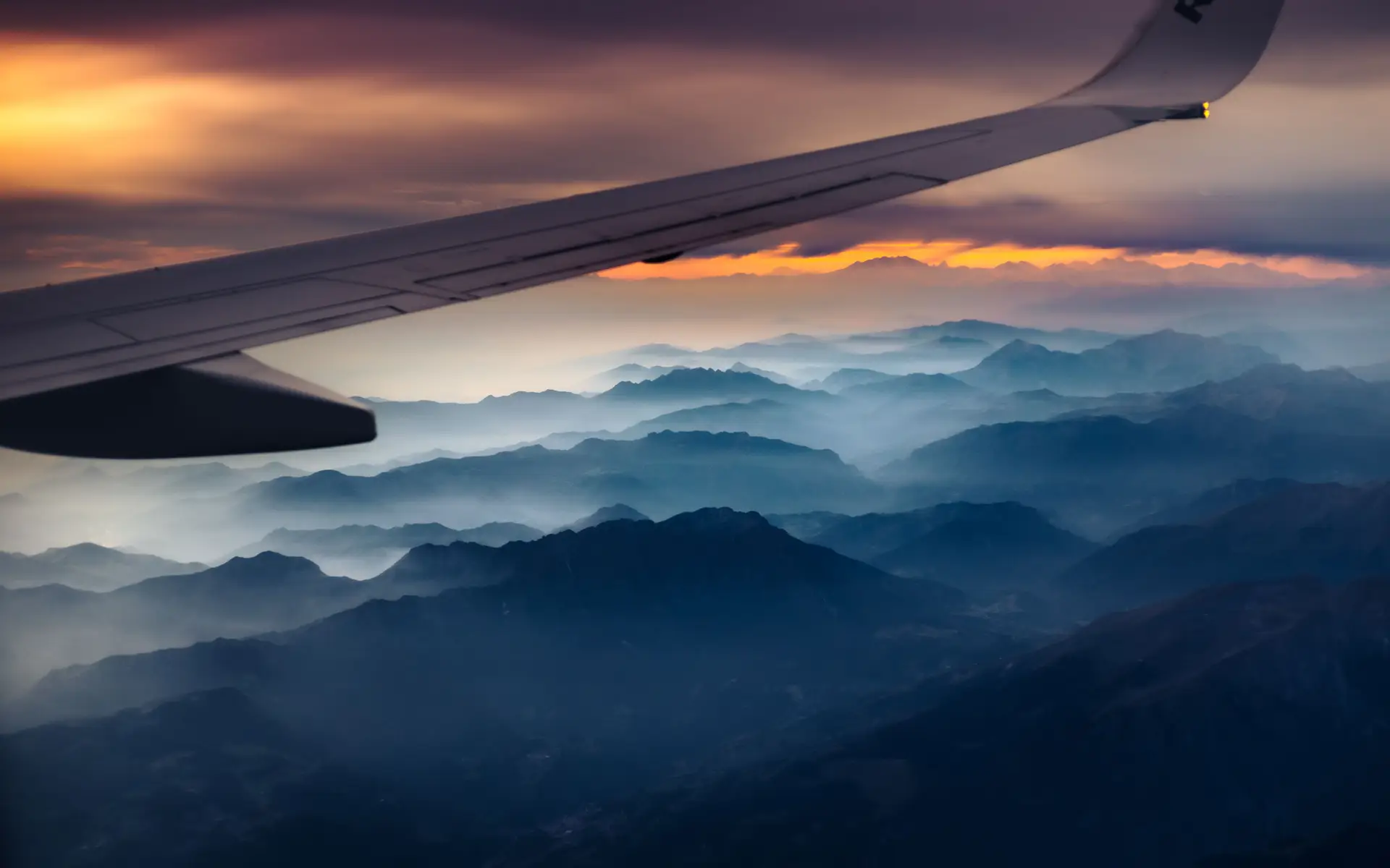 Aerial view of sunset over Alps from aircraft